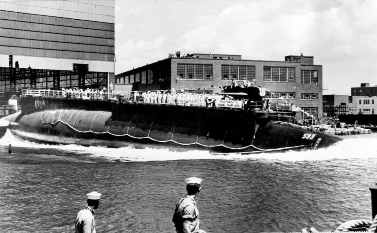 FILE - In this July 9, 1960 file photo the 278-foot (82 meters) long nuclear powered attack submarine USS Thresher, a first in its class boat, is launched bow-first at the Portsmouth Navy Yard in Kittery, Maine. The USS Thresher sank on April 10, 1963, killing all 129 crew on board, during an Atlantic Ocean test dive about 220 miles off the Massachusetts' coast. The release of about 3,000 pages of documents delving into the deadliest submarine disaster in U.S. history has not yielded any sinister effort to hide the truth, a retired Navy skipper says.