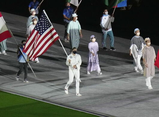 Kara Winger carries the flag of the United States of America during the closing ceremony of the 2020 Summer Olympics, Sunday in Tokyo, Japan.