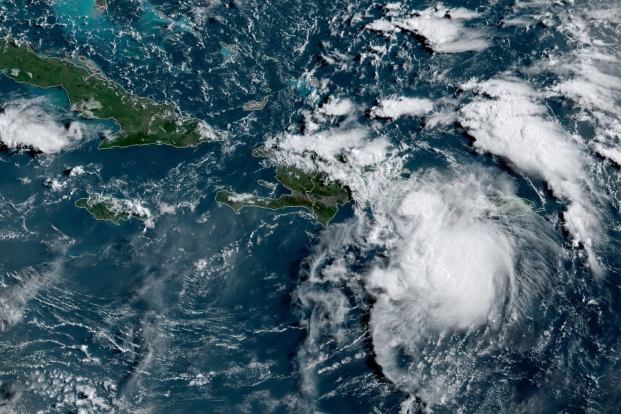 This satellite image provided by the National Oceanic and Atmospheric Administration (NOAA) shows a Tropical Storm Fred in the Caribbean as it passes south of Puerto Rico and the Dominican Republic at 8am EST, Wednesday, Aug. 11, 2021.