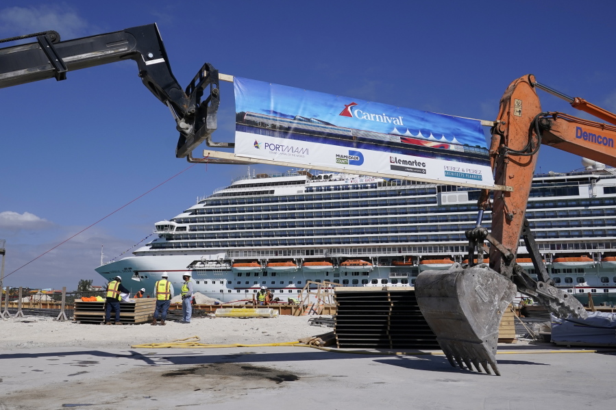 n this Friday, Jan. 29, 2021 photo, The Carnival Dream cruise ship arrives as construction work is underway for Carnival Cruise Line's new Terminal F, which will be the homeport to the Carnival Celebration cruise ship at PortMiami, in Miami.