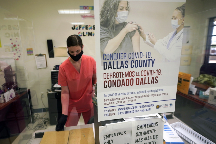 A Dallas County Health and Human Services nurse completes paperwork after administering a Pfizer COVID-19 vaccine at a county run vaccination site in Dallas, Thursday, Aug. 26, 2021.