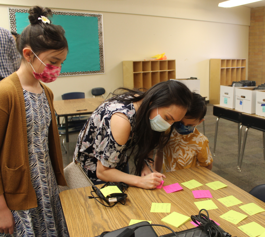 Fernanda Titcomb, center, attends a back-to-school event for Camas Connect Academy on Aug. 24 with her children, Anela, left, and Santiago. Titcomb said safety concerns related to the COVID-19 pandemic prompted her family to enroll in the district's remote school.