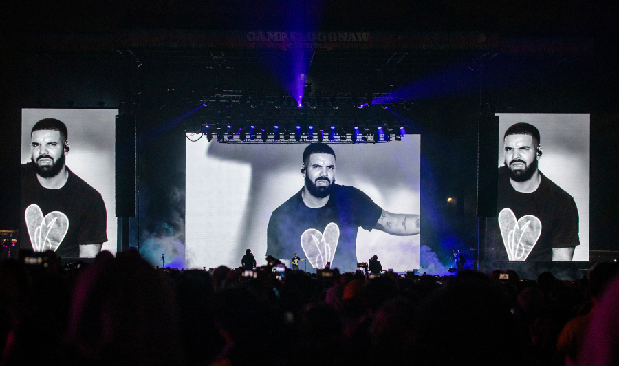 Drake is seen performing on a large television screen as he performs as one of three mystery guests of Tyler The Creator on the final day of Camp Flog Gnaw Carnival at Dodger Stadium parking lot on Nov. 10, 2019, in Los Angeles. (Allen J.