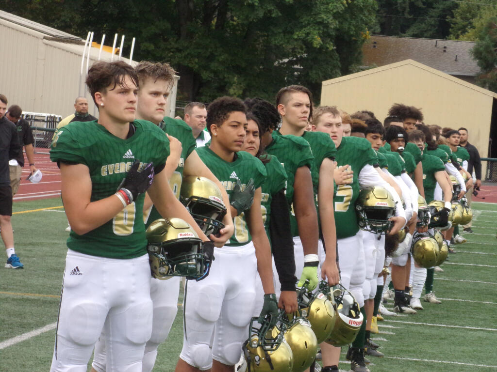 Evergreen players stand for the anthem prior to their game with Washougal on Friday, Sept.