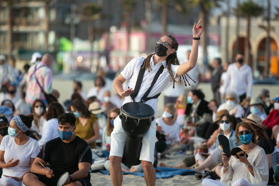 People take part in a Tashlich ceremony at Venice Beach on the first day of Rosh Hashanah on Wednesday, Sept. 8, 2021. High temperatures are forecast for Southern California through the weekend.