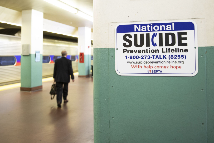 A sign for suicide prevention, photographed on the train platform at Suburban Station in Center City Philadelphia on Oct. 31, 2019.