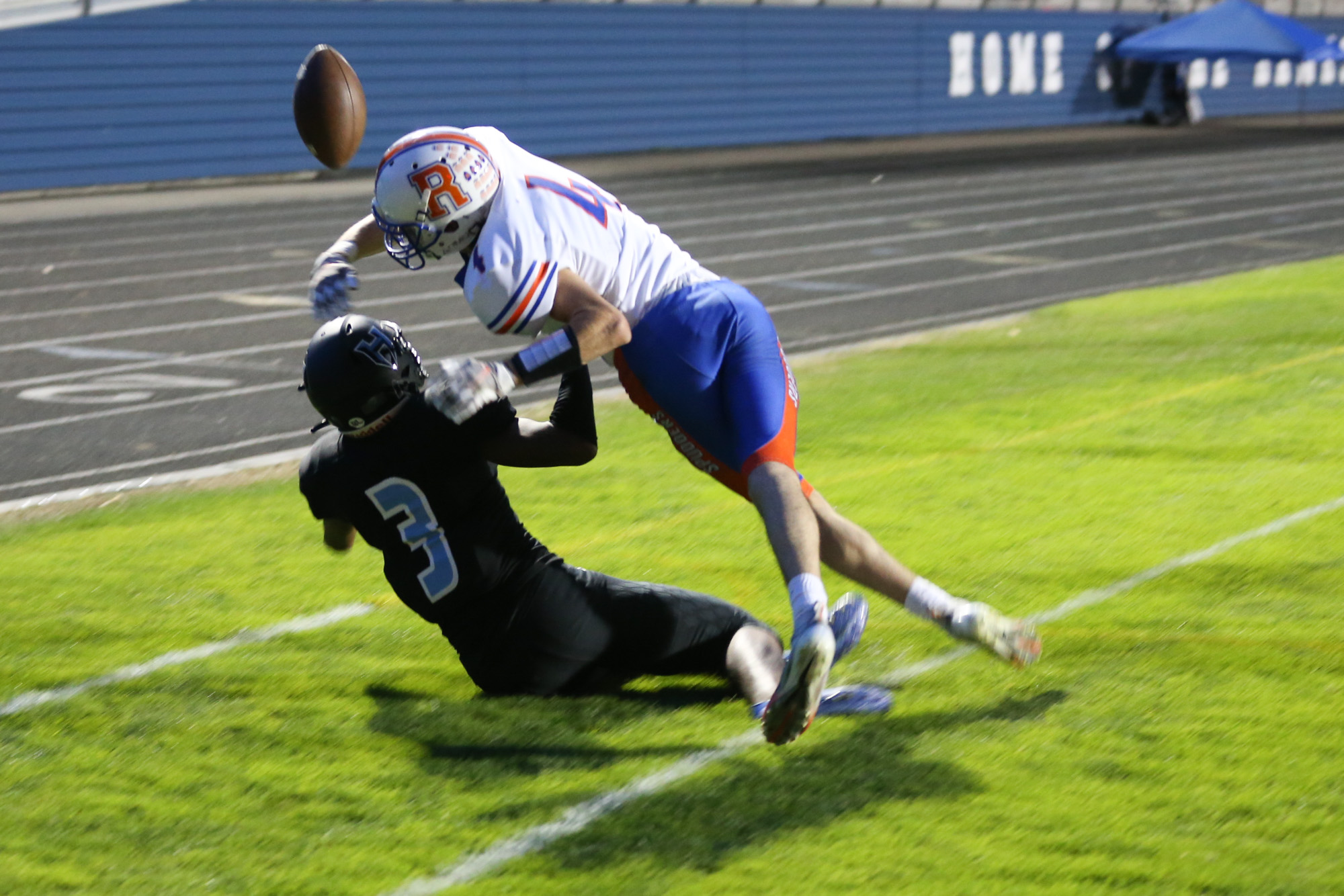 Ridgefield Spudders Ryan Jenkins (4) defends against a pass intended for Hockinson Hawks Kenyon Johnson (3) in first-half action in the 2A Greater St. Helens League season opener for both teams at Hockinson High School on Friday, Sept. 17, 2021. (Randy L.