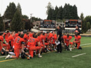 Washougal football coach Dave Hajek talks to his team after a 41-0 win over Woodland on Friday at Fishback Stadium.