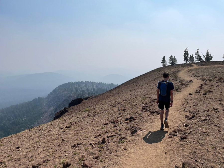 Mason Morical, 13, of Bend, Ore., walks across the summit of Tumalo Mountain on Sept. 5. When the air is clear, the alpine vistas atop the peak are tough to beat.