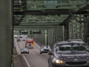 A truck joins other traffic crossing the Interstate 5 Bridge while traveling north on I-5 on Jan. 7, 2020. The Interstate Bridge Replacement Program office is aiming to settle on a single recommended configuration for a replacement bridge in January.
