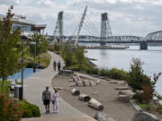 Amanda Cowan/The Columbian files
Pedestrians stroll along America's 13th-best riverwalk, right here in Vancouver.