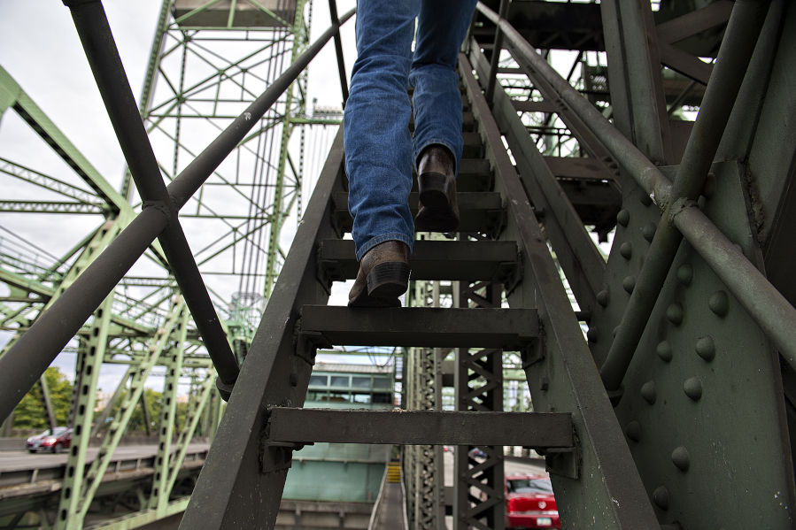 Marc Gross of the Oregon Department of Transportation climbs stairs as he gives a tour of the Interstate 5 Bridge on Aug.