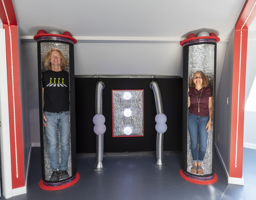 Kirby, left, and Patricia Swatosh stand in "freezing tubes" styled after those found in the TV show "Lost in Space" on Monday in their UFO-themed Airbnb in Brush Prairie.