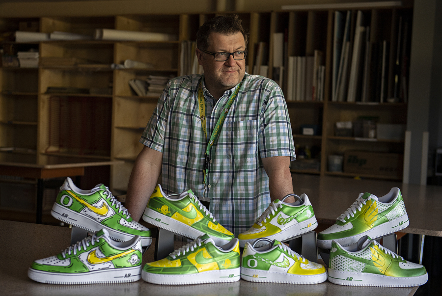 King's Way Christian Schools art teacher Justin Tigner, a professional sports artist, is traveling with the University of Oregon football team this fall as its game-day artist doing hand-painted shoe designs. Tigner also designs custom shoes and cleats for clientele including NFL players. He said he plans to blend two previous designs for custom shoes, a creation to be raffled off during Oregon football's alumni and donor tailgate Saturday at Ohio State.