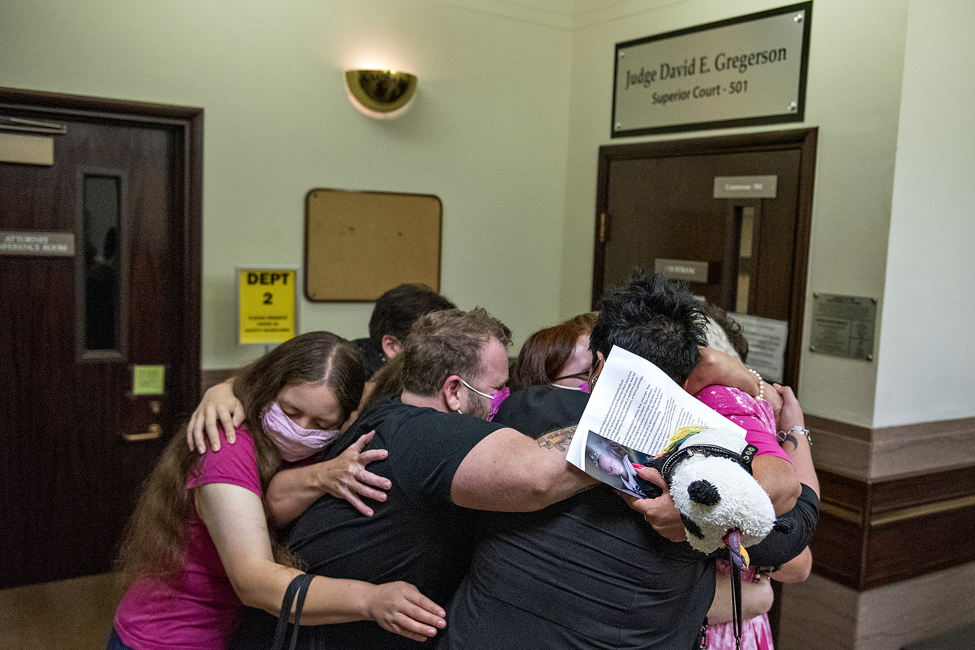 Family and supporters of slain transgender teen Nikki Kuhnhausen embrace Thursday morning, Sept. 9, 2021, after the sentencing of defendant David Bogdanov at the Clark County Courthouse. Bogdanov was sentenced to nearly 20 years in prison for the murder.