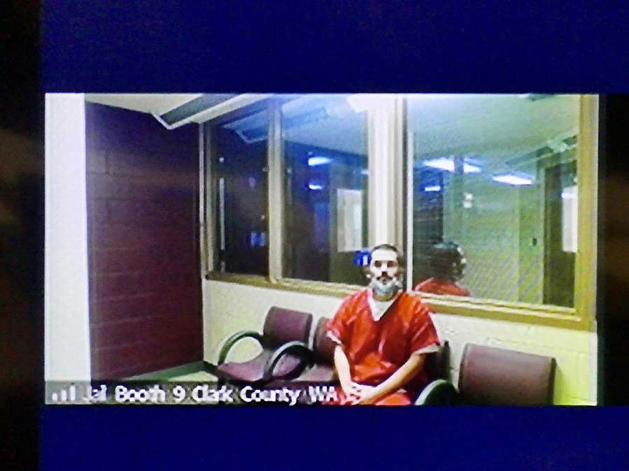 Guillermo Raya Leon appears Thursday via video in Clark County Superior Court to be arraigned on charges of first-degree aggravated murder and possession of a stolen firearm. He entered not-guilty pleas to both counts.