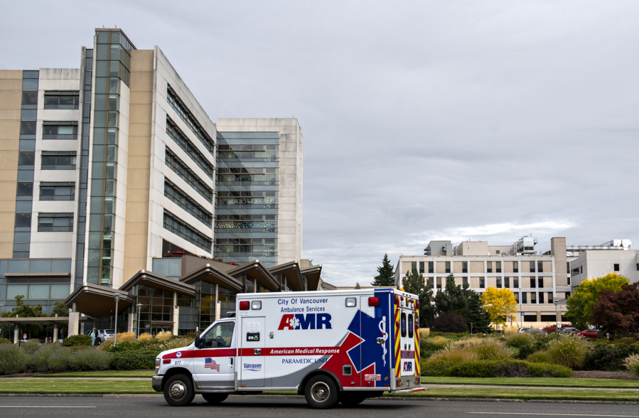 An ambulance passes PeaceHealth Southwest Medical Center on Wednesday.