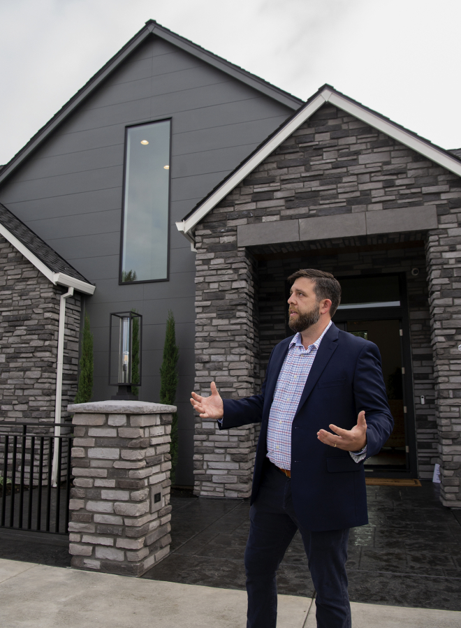 Russell Mistich, a James Hardie new product commercialization manager, discusses the new siding present on multiple homes at the Northwest Natural Parade of Homes on Wednesday.
