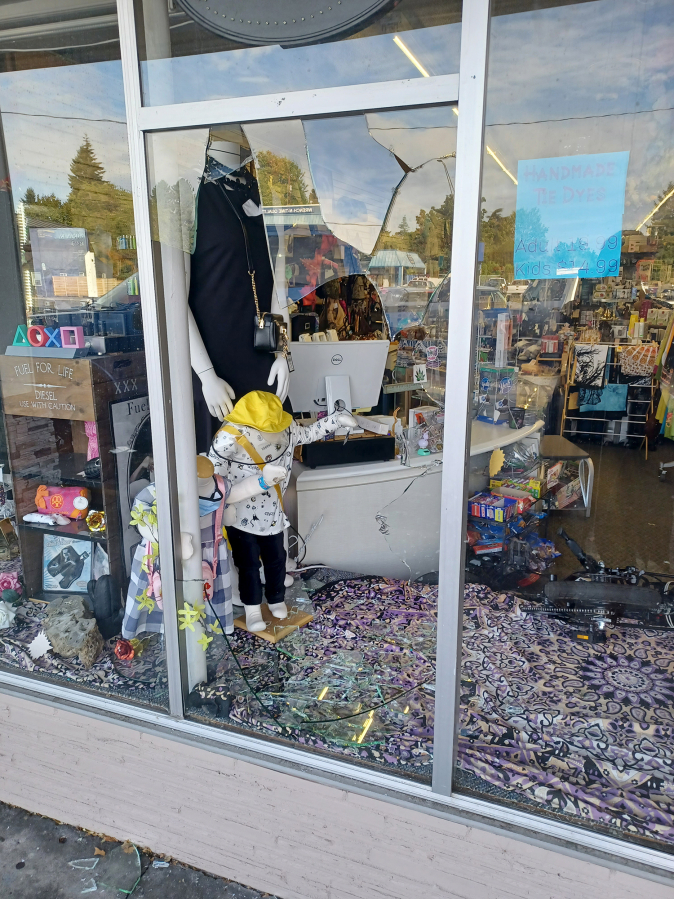 A window is smashed at Vancouver boutique LiquidNation Liquidators. Owner Jullienne Adams arrived at her store Wednesday morning to find the glass shattered and $3,000 worth of merchandise stolen.