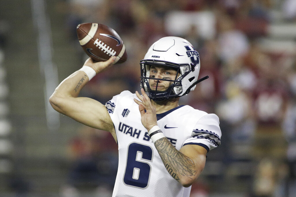 Utah State quarterback Andrew Peasley throws a pass during the first half of the team's NCAA college football game against Washington State, Saturday, Sept. 4, 2021, in Pullman, Wash.