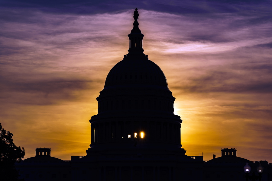 The sun rises behind the Capitol in Washington, Wednesday, Sept. 15, 2021. (AP Photo/J.
