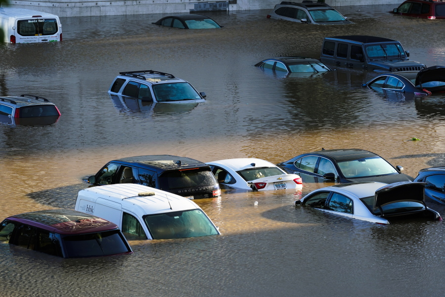 Vehicles are under water during flooding in Philadelphia, Thursday, Sept. 2, 2021 in the aftermath of downpours and high winds from the remnants of Hurricane Ida that hit the area.