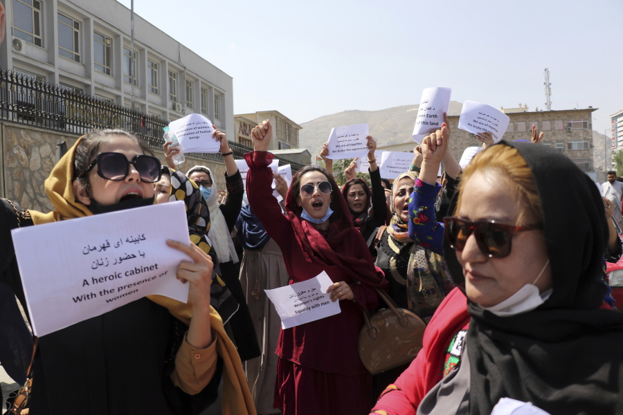 Women gather to demand their rights under the Taliban rule during a protest in Kabul, Afghanistan, Friday, Sept. 3, 2021. As the world watches intently for clues on how the Taliban will govern, their treatment of the media will be a key indicator, along with their policies toward women. When they ruled Afghanistan between 1996-2001, they enforced a harsh interpretation of Islam, barring girls and women from schools and public life, and brutally suppressing dissent.