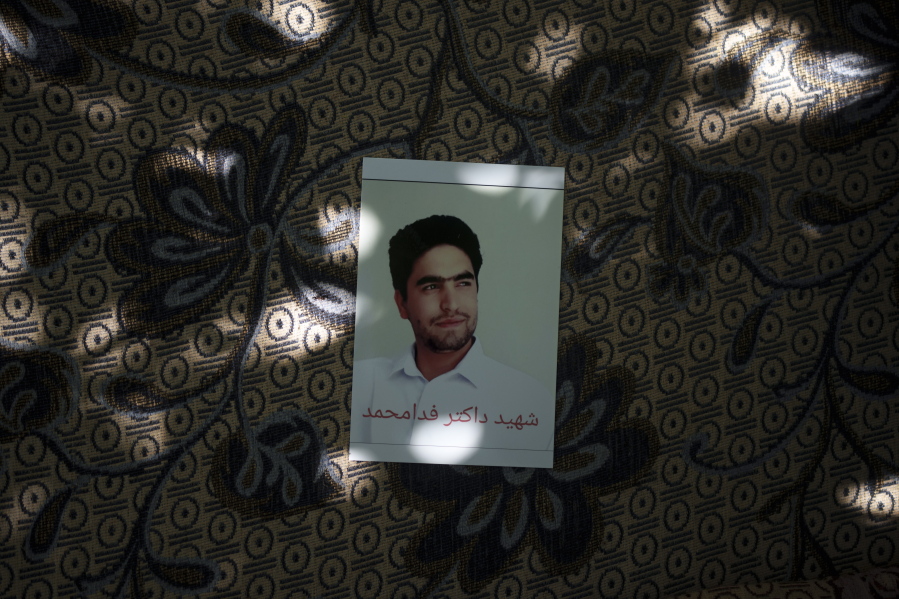 A portrait of Fida Mohammad, a 24-year-old dentist, who died after falling from a departing U.S. Air Force C-17 on Aug. 16, hangs in his family house in Kabul, Afghanistan, Friday, Sept. 17, 2021.