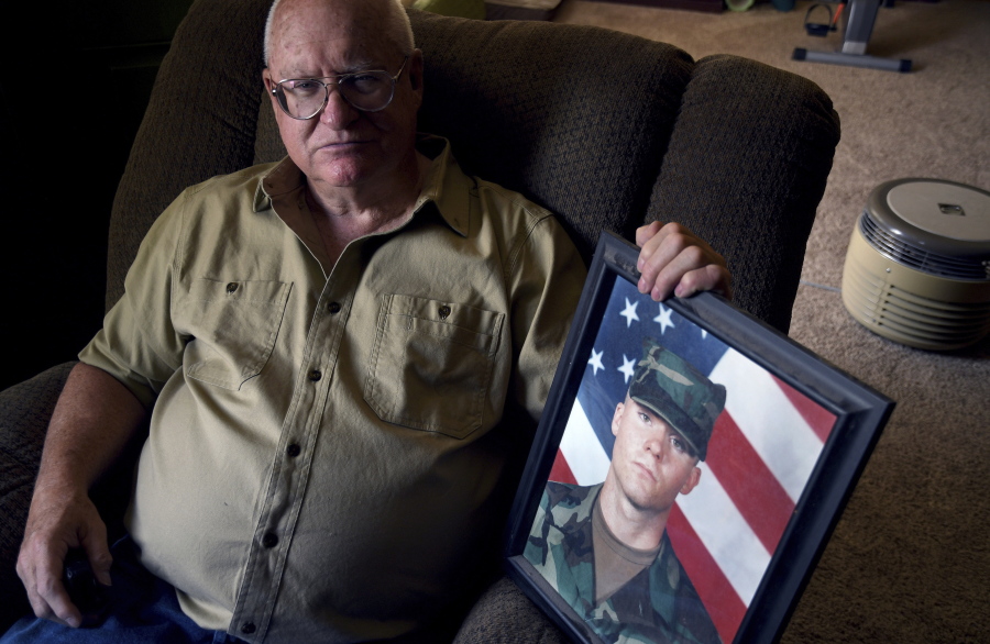 Donn Edmunds, a 25-year U.S. Army veteran who served in Vietnam, sits for a portrait in his living room in Cheyenne, Wyo., Wednesday, Sept. 1, 2021. Edmunds' son, Army Ranger Spc. Jonn Edmunds, and another soldier died when a Black Hawk helicopter on a search-and-rescue mission crashed in Pakistan in October 2001. They were among the first U.S. casualties in the Afghanistan war.