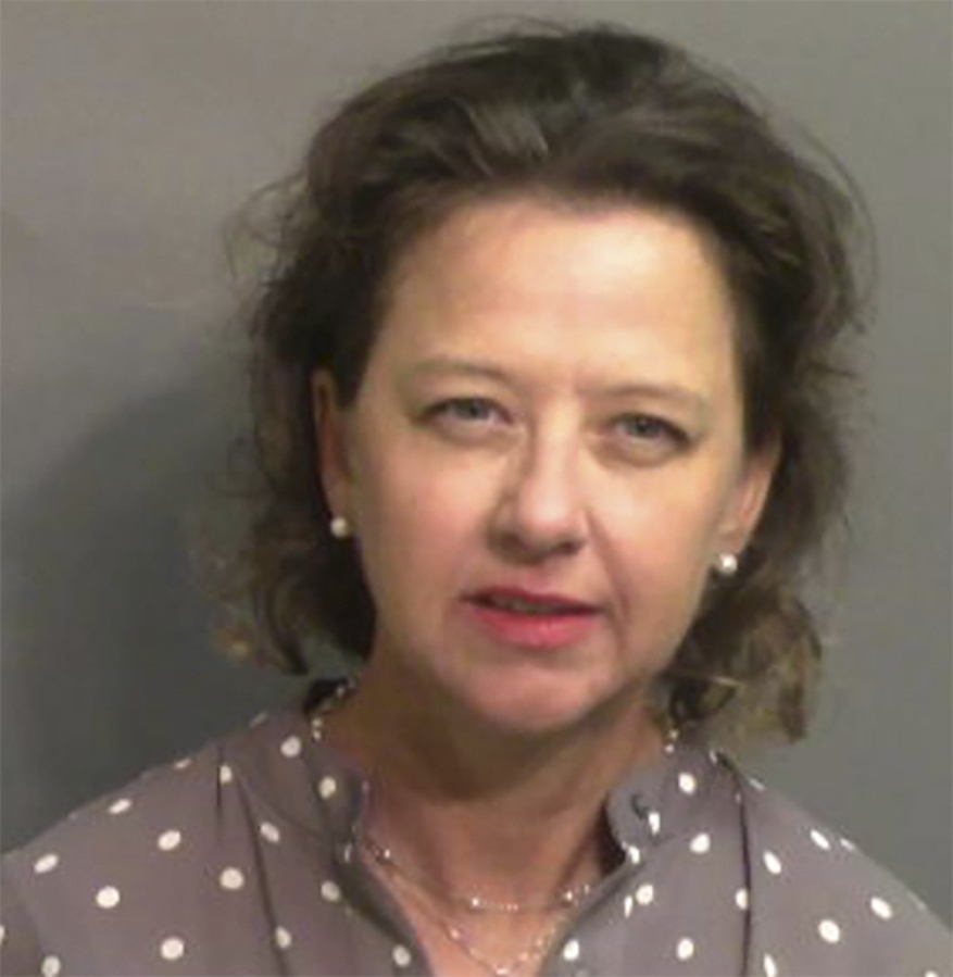 This jail booking photo provided by Glynn County Sheriff's Office, shows Jackie Johnson, the former district attorney for Georgia's Brunswick Judicial Circuit, after she turned herself in to the Glynn County jail in Brunswick, Ga, on Wednesday, Sept. 8, 2021.  A grand jury indicted Johnson on charges of violating her oath of office and obstructing police in her handling of the February 2020 killing of Ahmaud Arbery. The indictment accuses Johnson of using her position to try to shield Arbery's killers from prosecution. She has denied any wrongdoing.