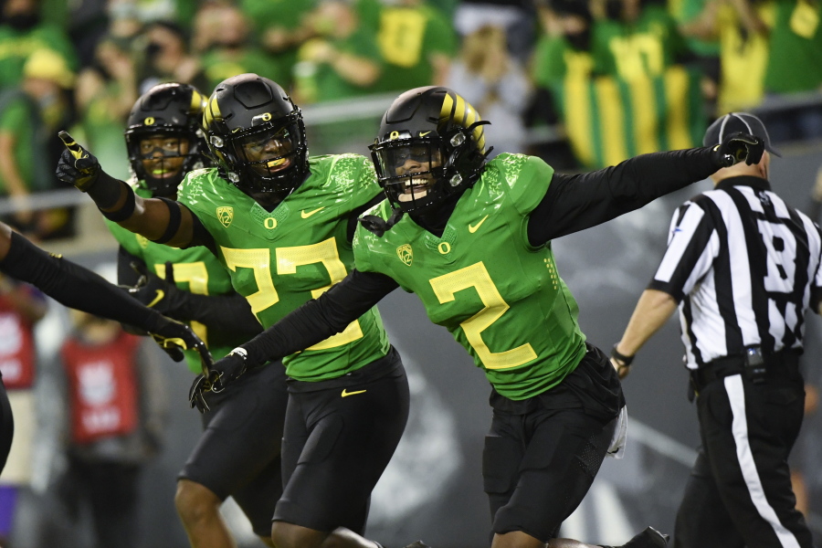 Oregon cornerback Mykael Wright (2) celebrates his interception with Oregon safety Verone McKinley III (23) during the first quarter of an NCAA college football game Saturday, Sept. 25, 2021, in Eugene, Ore.