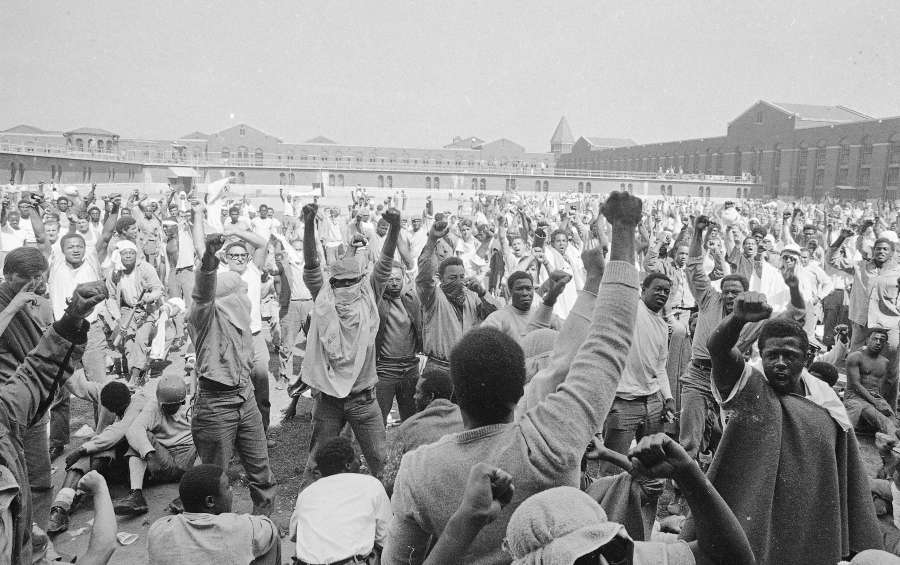 Inmates at the Attica Correctional Facility in Attica, N.Y., raise their hands in clenched fists in a show of unity during the Attica uprising in September 1971.