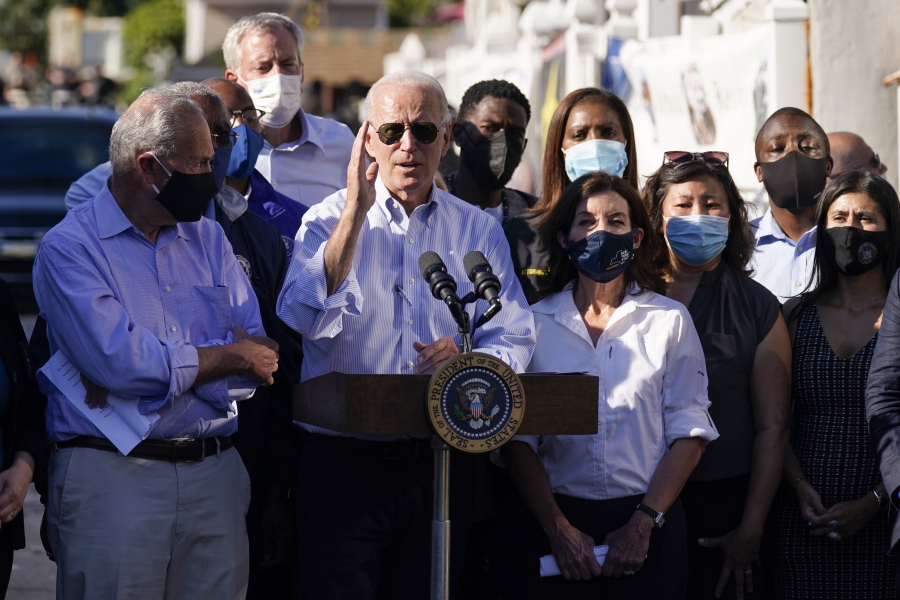 President Joe Biden speaks as he tours a neighborhood impacted by flooding from the remnants of Hurricane Ida, Tuesday, Sept. 7, 2021, in the Queens borough of New York.