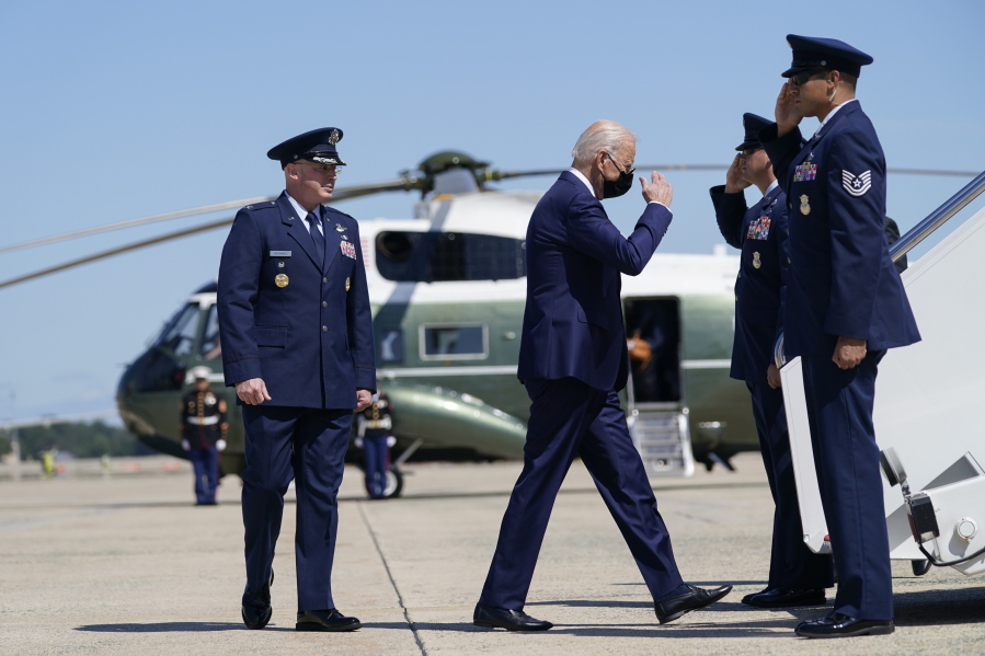 President Joe Biden returns a salute as he walks to board Air Force One to travel to Louisiana to view damage caused by Hurricane Ida, Friday, Sept. 3, 2021, in Andrews Air Force Base, Md.