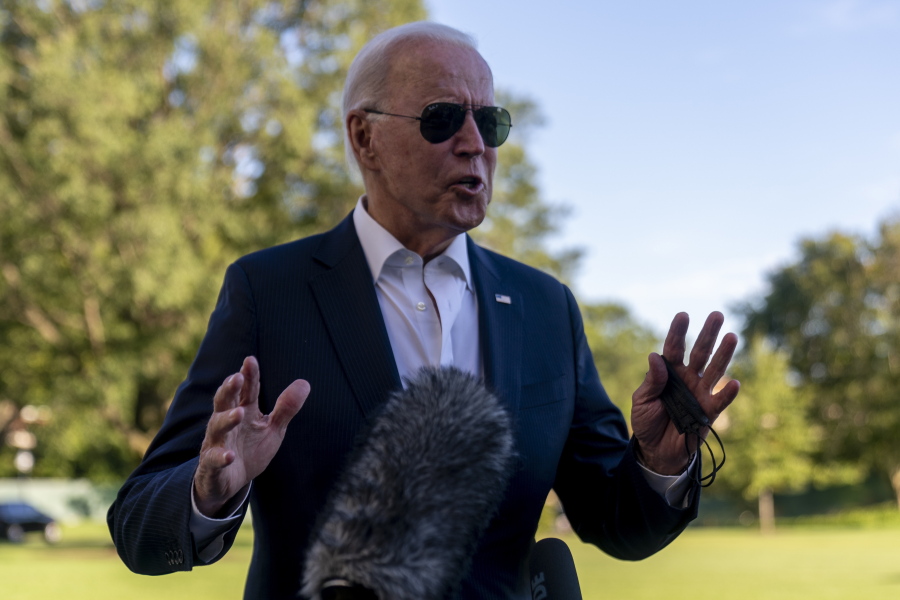 President Joe Biden stops to speak to members of the media as he arrives at the White House in Washington, Sunday, Sept. 26, 2021, after returning from a weekend at Camp David.