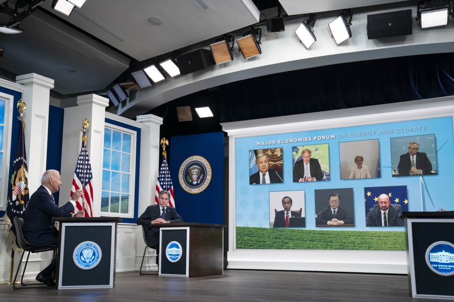 Secretary of State Antony Blinken listens as President Joe Biden delivers remarks to the Major Economies Forum on Energy and Climate, in the South Court Auditorium on the White House campus, Friday, Sept. 17, 2021, in Washington.