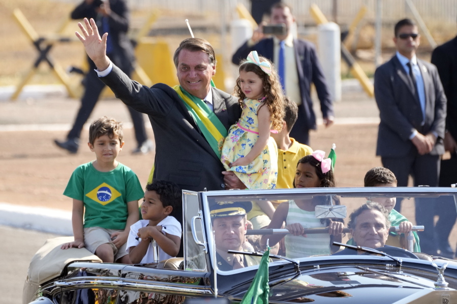 President Jair Bolsonaro arrives for a flag raising ceremony Tuesday at Alvorada Palace in Brasilia, Brazil.