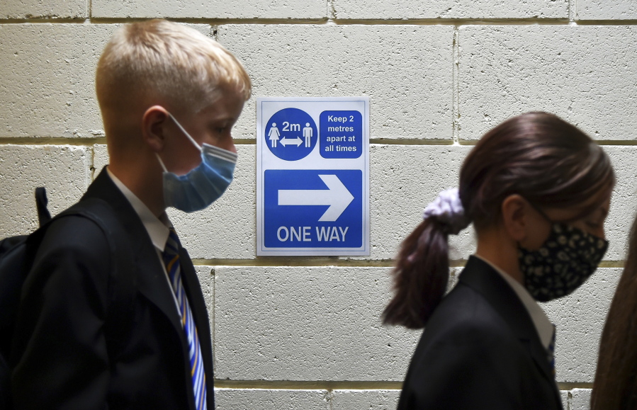 Pupils at Covid test station as they entered their new secondary school for the first time at Wales High school, Sheffield, England, Friday, Sept. 3, 2021. Fewer measures are in place in schools than during last term, with bubbles and masks no longer in use in England and Wales, while Northern Ireland has also scrapped social distancing requirements.