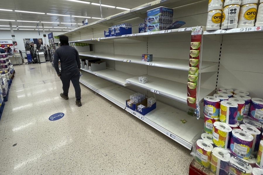 A view of empty shelves at a supermarket in London, Monday, Sept. 20, 2021. Retailers, manufacturers and food suppliers have reported disruptions due to a shortage of truck drivers linked to the pandemic and Britain's departure from the European Union, which has made it harder for many Europeans to work in the U.K.