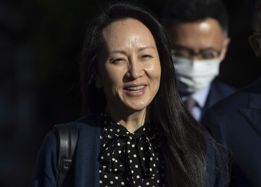Meng Wanzhou, chief financial officer of Huawei, smiles as she leaves her home in Vancouver on Friday, Sept. 24, 2021.