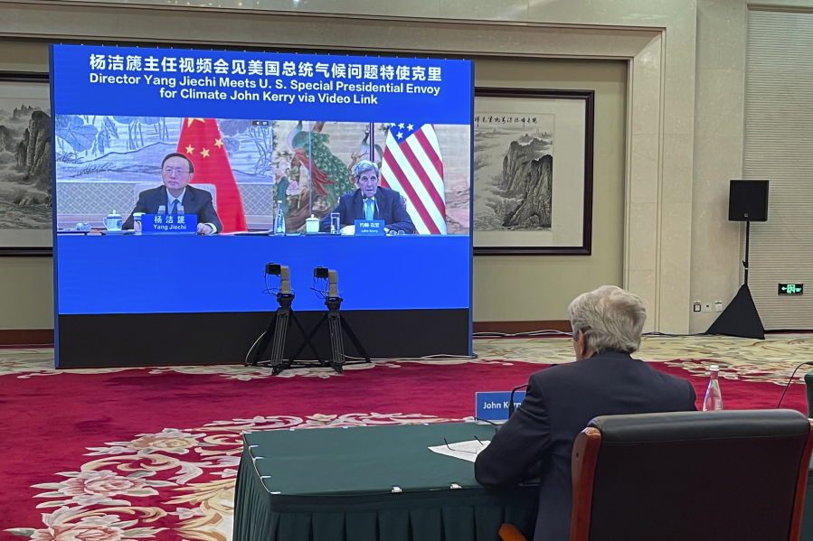FILE - In this Sept. 2, 2021, file photo provided by the U.S. Department of State, U.S. Special Presidential Envoy for Climate John Kerry attends a meeting with Yang Jiechi, director of China's Office of the Central Commission for Foreign Affairs, via video link in Tianjin, China. Kerry came to China seeking to press the world's largest emitter of greenhouse gases to do more in the global effort to hold down the rise in temperature. What he got was renewed demands for Washington to change its stance toward China on a host of other issues from human rights to Taiwan. (U.S.