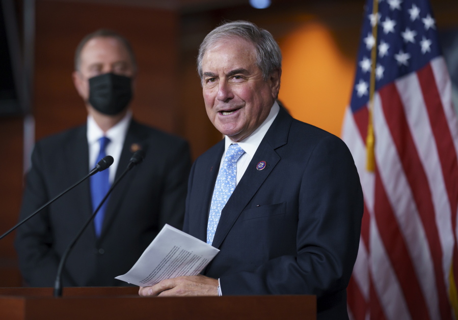 FILE - In this Sept. 21, 2021, file photo House Budget Committee Chair John Yarmuth, D-Ky., joined at left by House Intelligence Committee Chairman Adam Schiff, D-Calif., talks to reporters at the Capitol in Washington. (AP Photo/J.