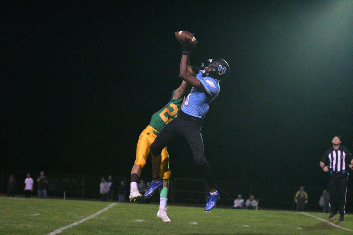 Hockinson's Kenyon Johnson goes high for a catch  in the Hawks' 24-21 loss to Lynden on Friday, Sept.