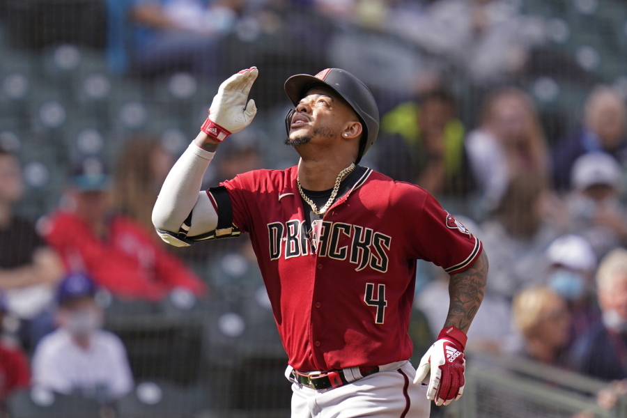 Arizona Diamondbacks' Ketel Marte motions as he heads home on his solo home run against the Seattle Mariners in the seventh inning of a baseball game Sunday, Sept. 12, 2021, in Seattle.