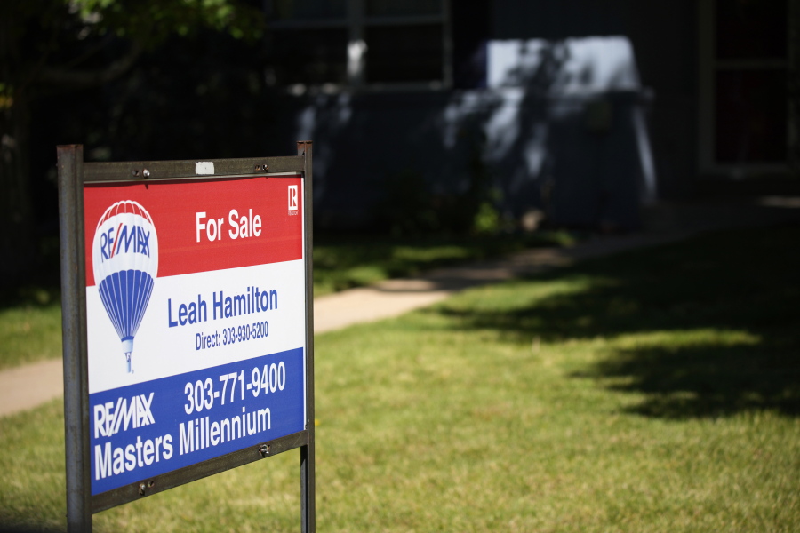 A sale sign stands outside a home on the market Tuesday, Sept. 21, 2021, in southeast Denver. The National Association of Realtors releases existing home sales for August on Wednesday, Sept. 22.