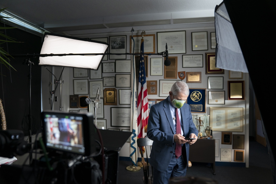 This image released by National Geographic shows Dr. Anthony Fauci at the NIH in Bethesda, Md., during the filming of the documentary "Fauci." John Hoffman and Janet Tobias's portrait of the director of the National Institute of Allergy and Infectious Diseases will screen only in theaters mandating vaccination and masking.