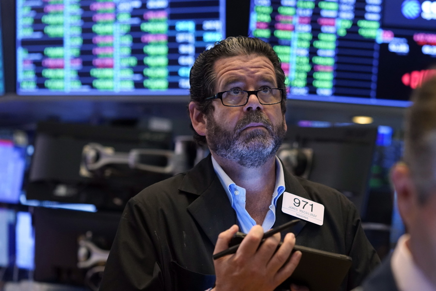 Trader James Macgilvray works on the floor of the New York Stock Exchange, Tuesday, Sept. 21, 2021. Stocks are opening modestly higher on Wall Street, making up some of the ground they lost in a sharp pullback a day earlier.