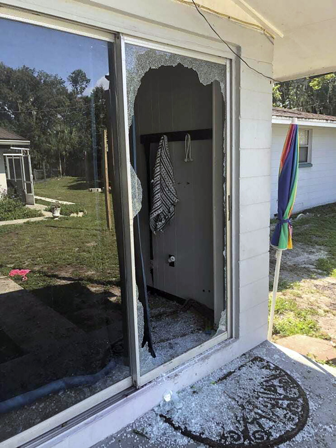This image provided by the Polk County Sheriff's Office shows the back of the residence where a Polk sheriff's lieutenant entered the house and exchanged fire with a shooting suspect in a neighborhood in Lakeland, Fla.