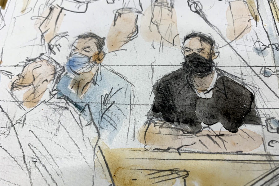 FILE - Sept.8, 2021 file sketch shows key defendant Salah Abdeslam, right, and Mohammed Abrini in the special courtroom built for the 2015 attacks trial.