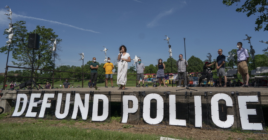 FILE - In this Sunday, June 7, 2020, file photo, Alondra Cano, a city council member, speaks during "The Path Forward" meeting at Powderhorn Park in Minneapolis, which was organized to talk about the defunding of the Minneapolis Police Department. On Tuesday, Sept. 14, 2021, a judge rejected an attempt to salvage a proposed charter amendment on the future of policing in Minneapolis, ruling just days before early and absentee voting begins in the city where George Floyd died in police custody that any votes on the question won't count.